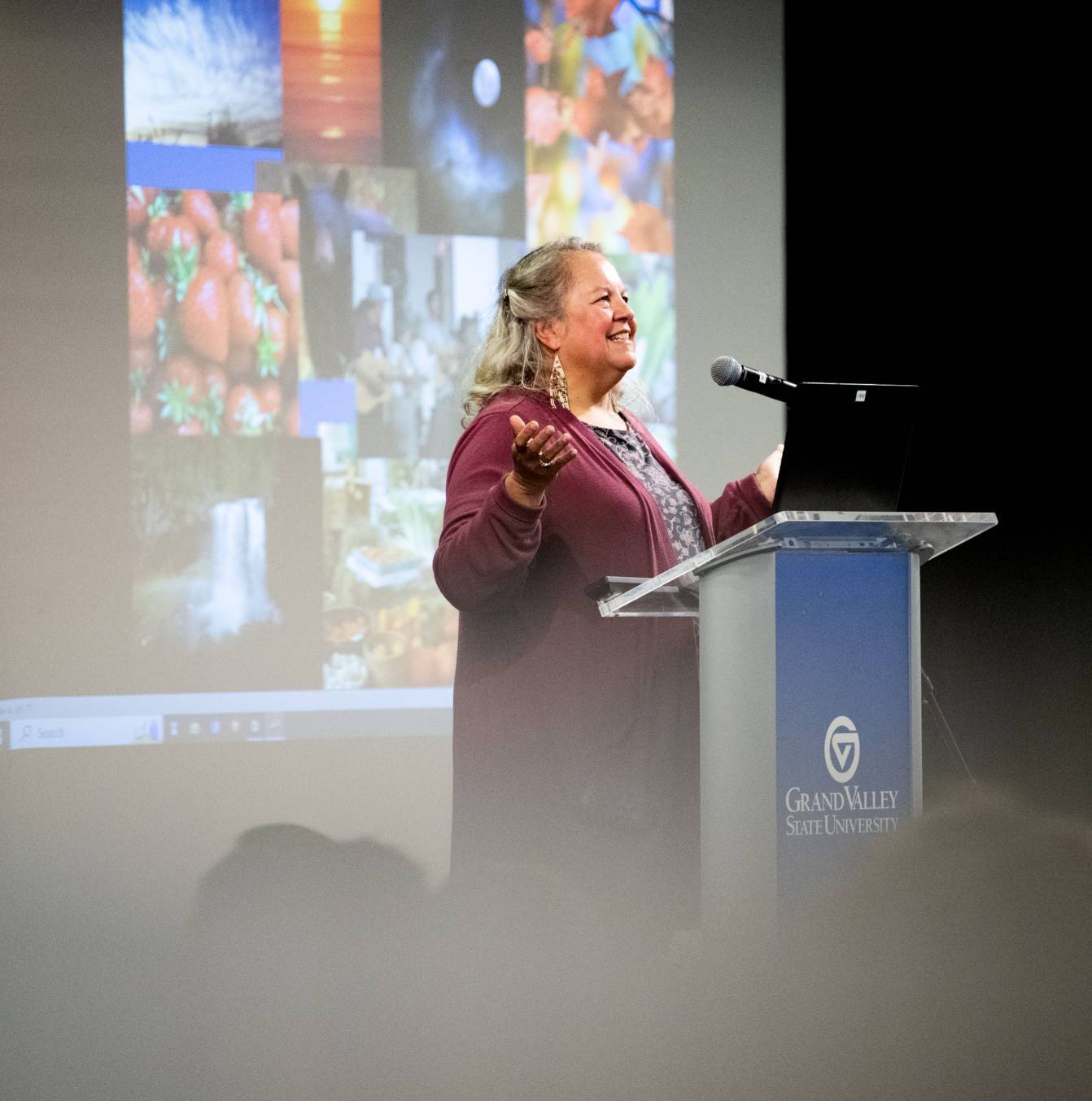 Robin Wall Kimmerer at a podium speaking in the Grand River Room